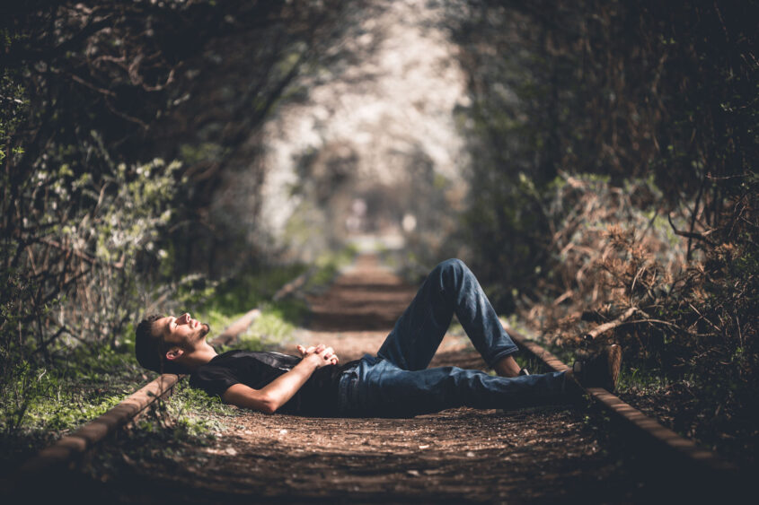 Man Sleeping on Road