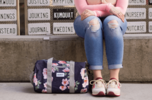 Picture of women sitting across crossfit bag