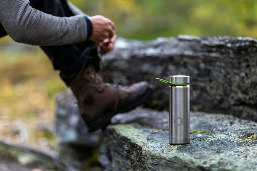 Picture of man in black long sleeve shirt with water bottle