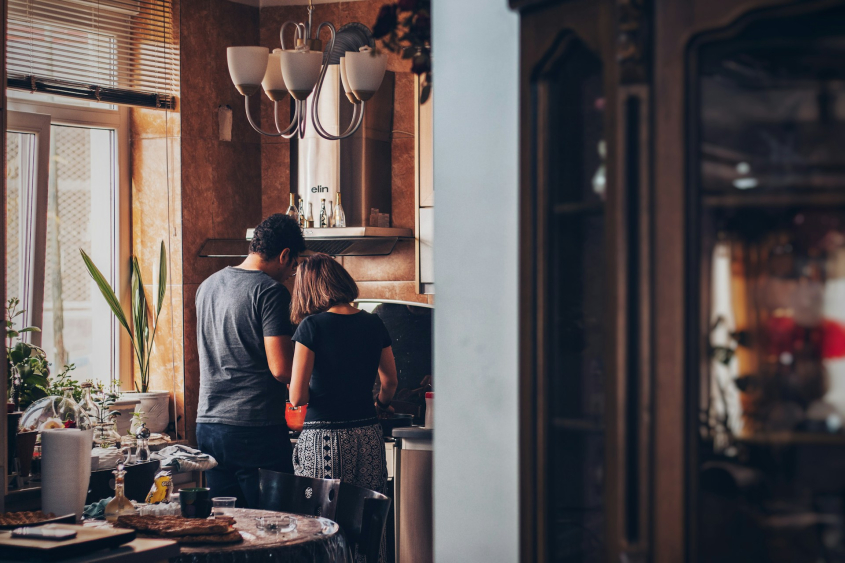 Picture of couple cooking together at home - couple indoor activity