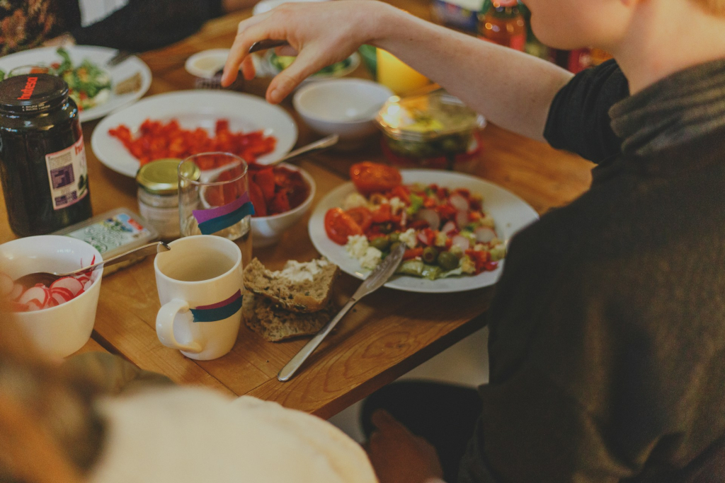 Picture of person in front of table with salsa dish