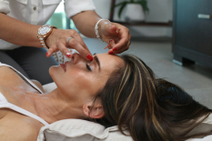 Picture of person holding women nose to the point of relaxation